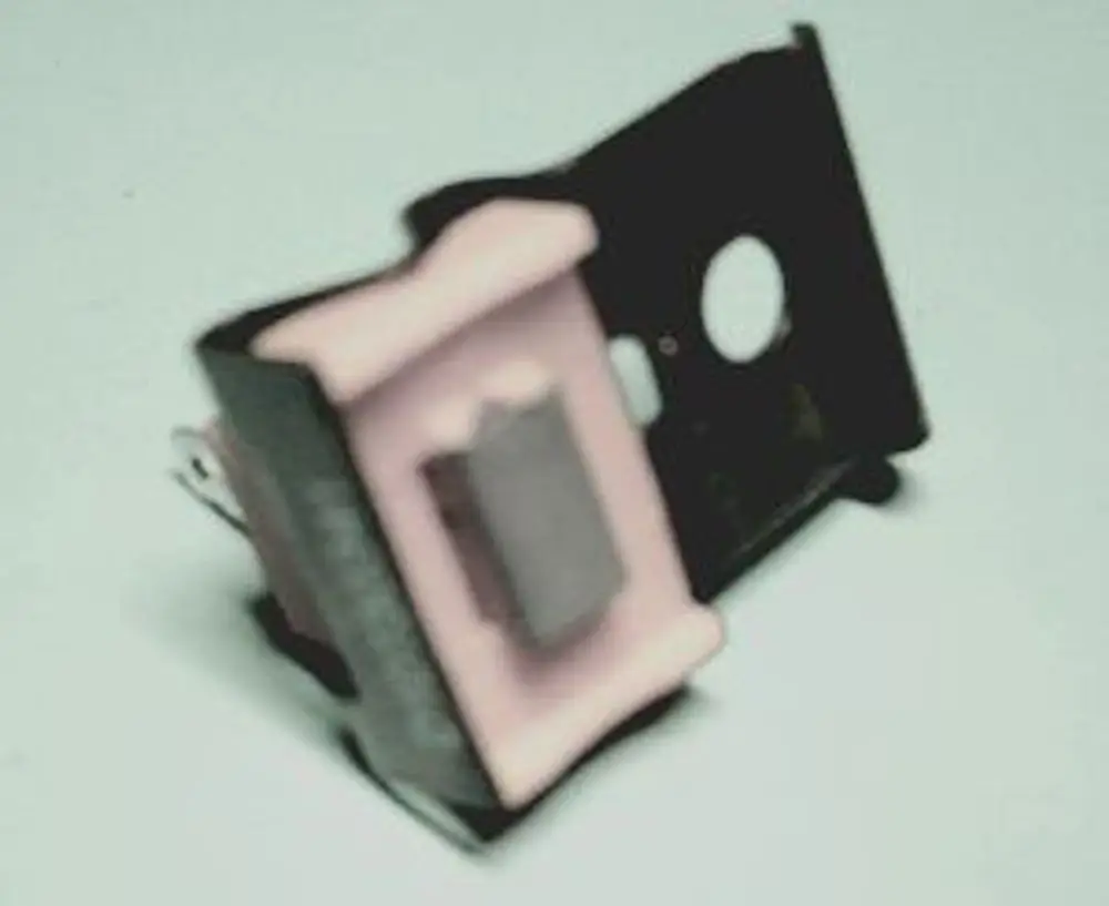 Abgasfühler von Remeha, mit schwarzem Gehäuse und pinker Gummidichtung, platziert auf flacher Oberfläche, zur Messung von Abgaswerten konzipiert.
